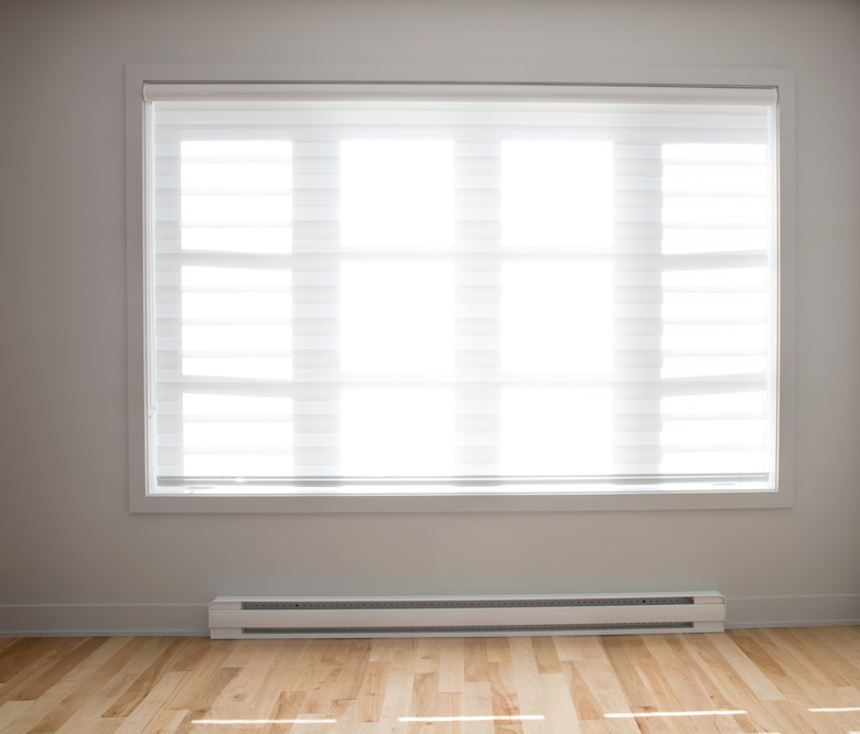 Large residential window with wooden floors