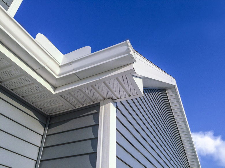 New soffit, gutters, vinyl siding.