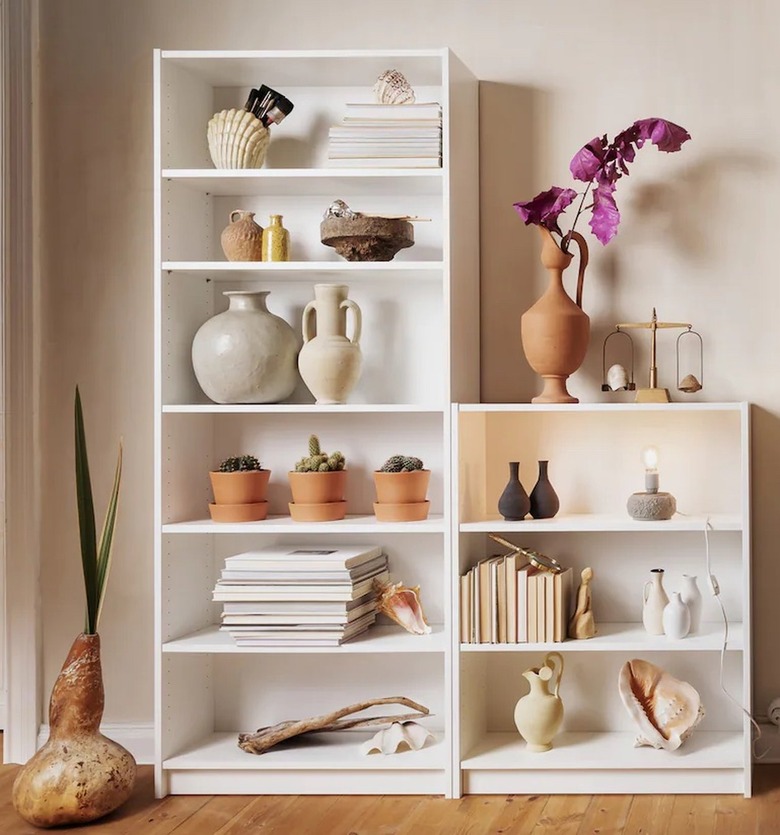 ikea white billy bookcase with books and vases