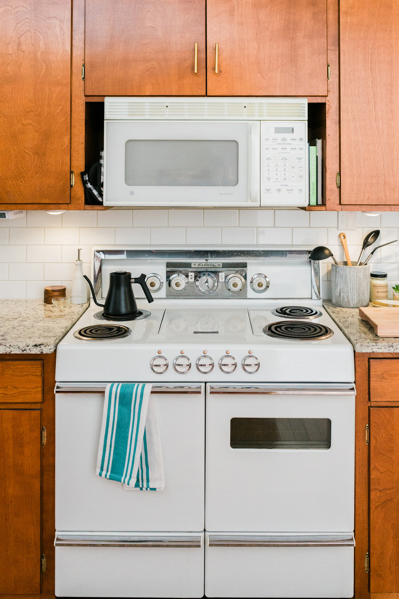 White electric stove in midcentury kitchen