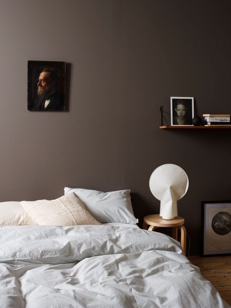 dark bedroom with chocolate brown wall color