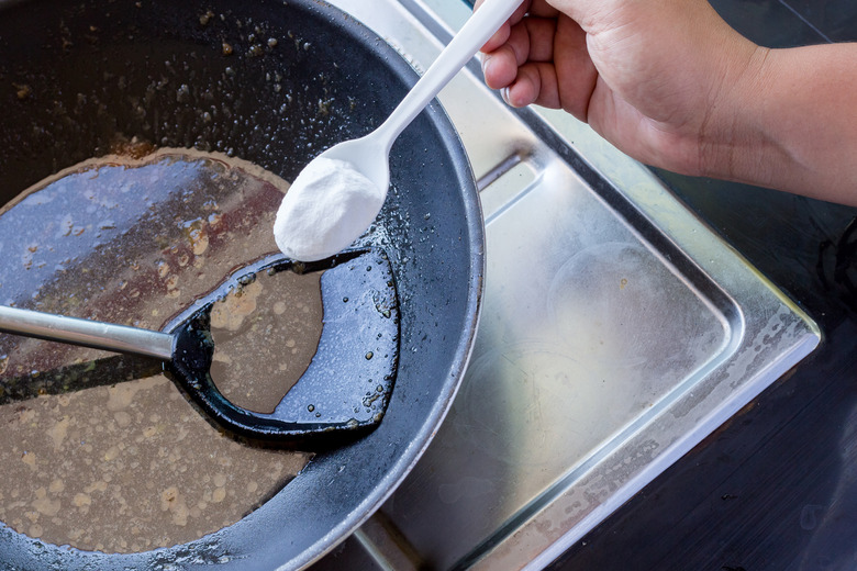 Baking soda to soak and remove burnt-on food in the bottom of pots and pans