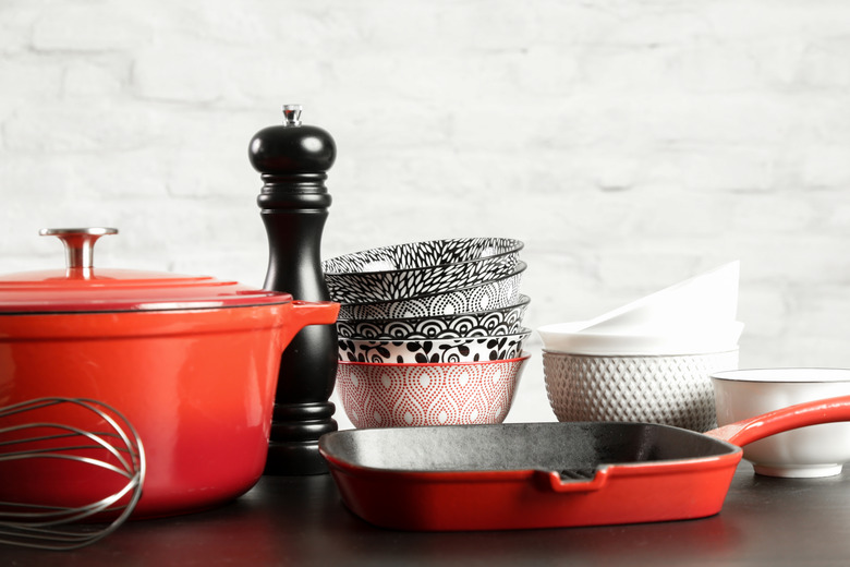 Cookware set: Red enameled cast iron pot, saucepan and bowls