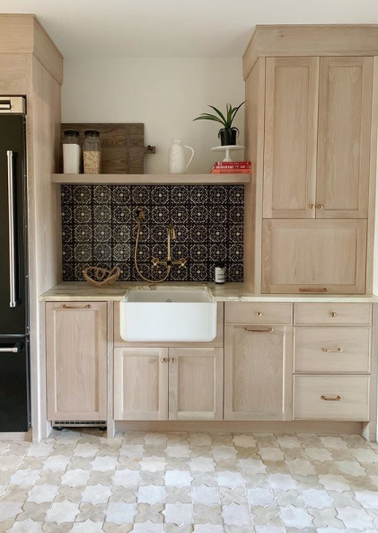 star motif Moroccan kitchen floor tiles with wood cabinets