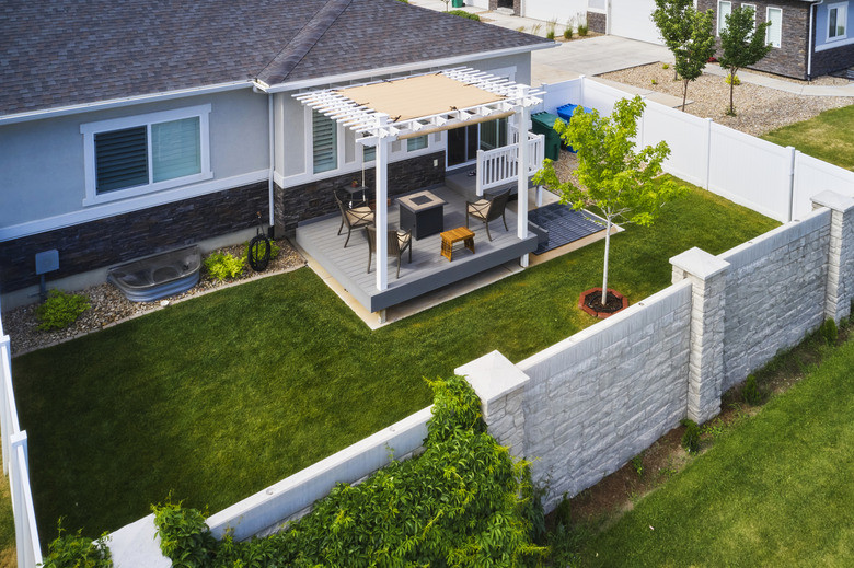 Small Backyard With Deck, Pergola, And Privacy Fence