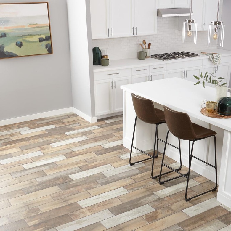 kitchen space with white cabinets and multicolored porcelain tile floor