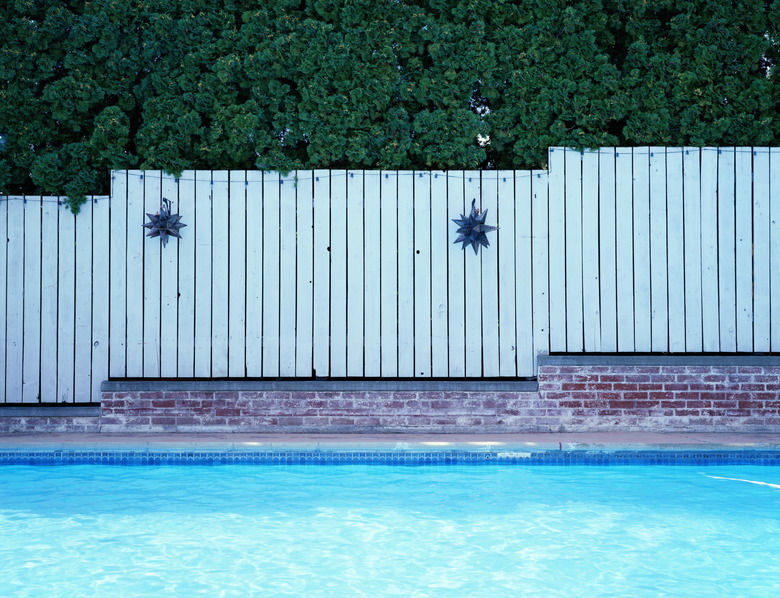 Fence alongside swimming pool