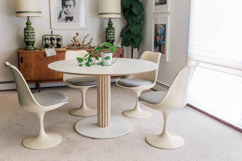 Midcentury modern dining room with white table and chairs