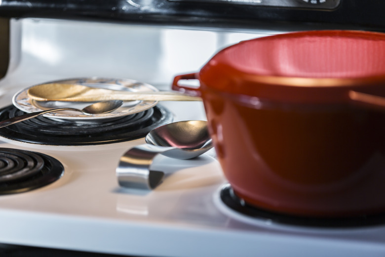 Red Cooking Pot On Kitchen Electric Range Stovetop Circular Burner