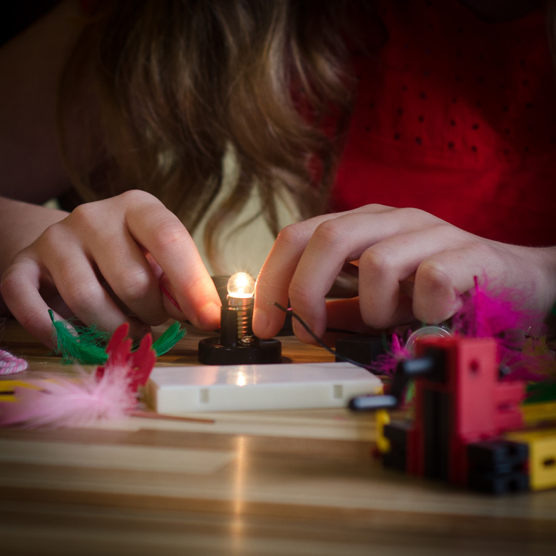 Girl Connects Lightbulb