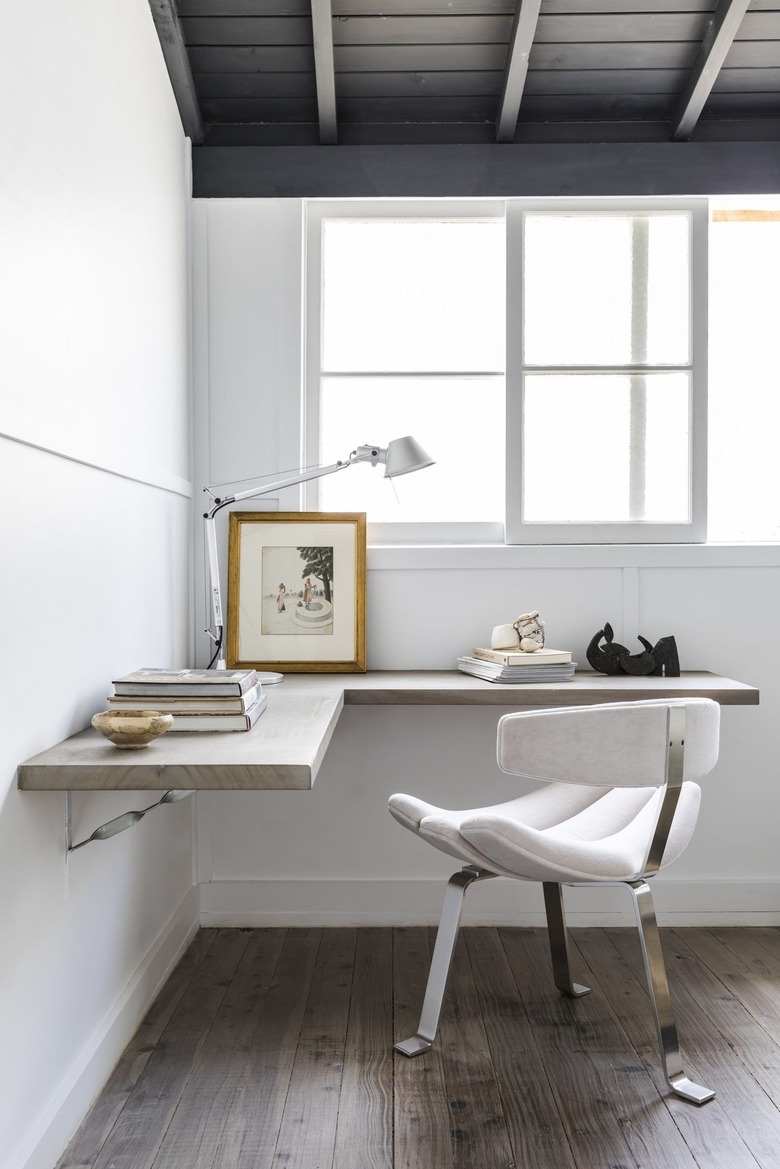 gray corner office with floating L-shaped desk