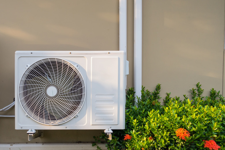 Air conditioning system installation embedded on wall of building