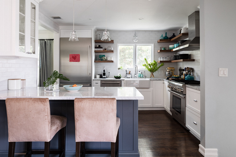 small kitchen with peninsula, subway tile, stainless steel appliances