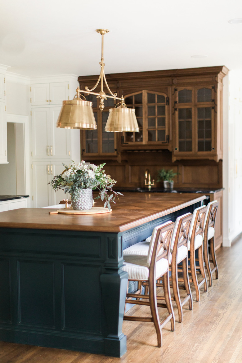 traditional kitchen lighting with brass fixture over island