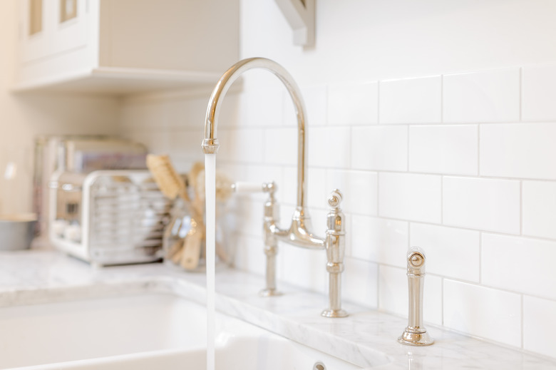 Water running from kitchen sink faucet