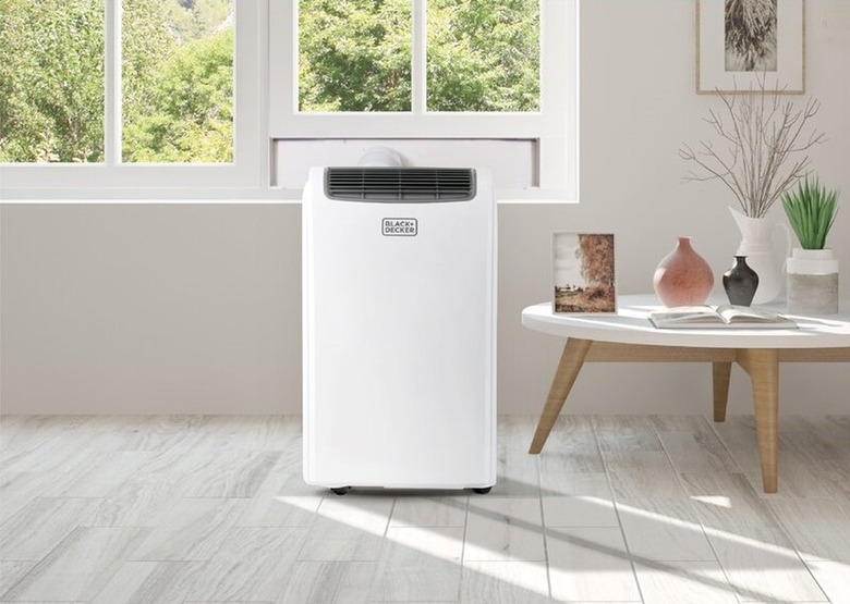 White portable air conditioner in white and gray living room