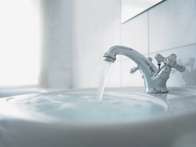 Close up of overflowing bathroom sink