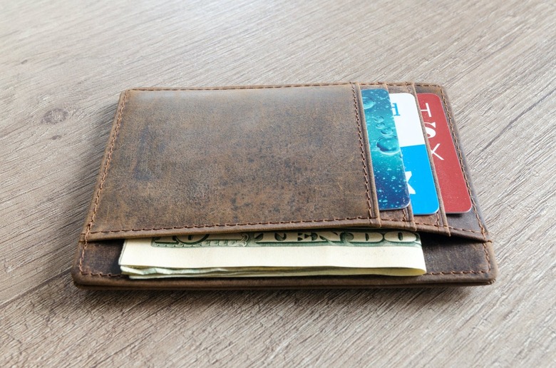 wallet filled with credit cards and money