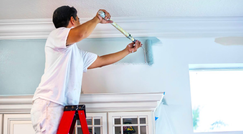 Painting an interior wall.