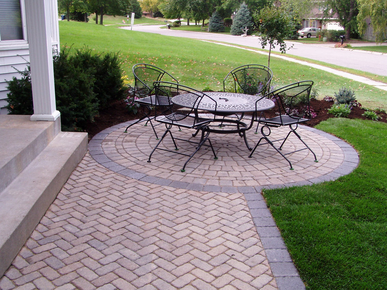 Front entry patio with round seating area.