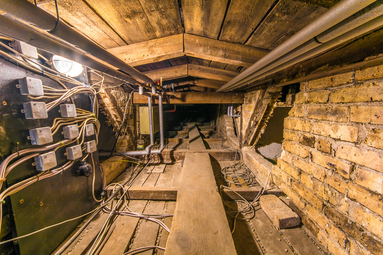 Roof truss of an old residential building with complicated electrical system