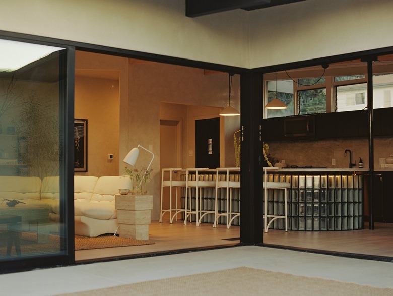 New sliding glass doors open the home to the outside.