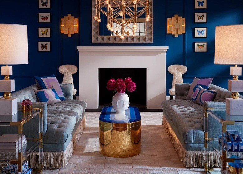 Maximalist living room with deep blue walls