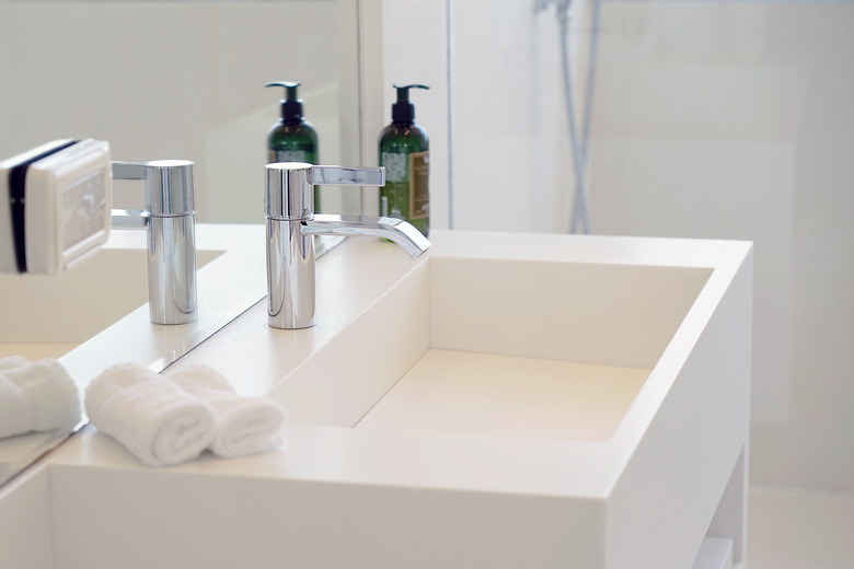 Modern white bathroom sink with faucet