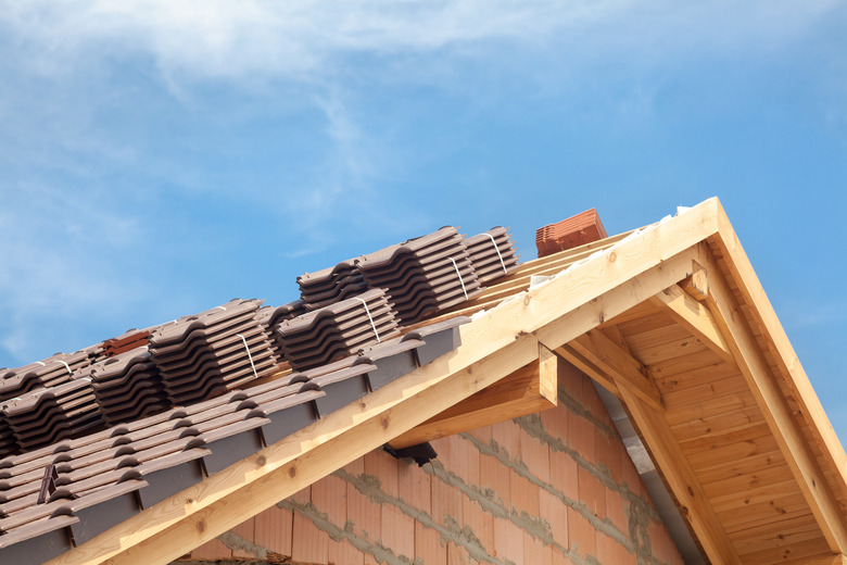 House under construction. Roofing tiles preparing to Install