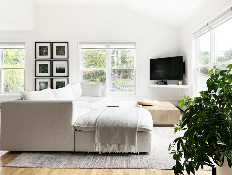 Cream colored couch in light filled living room