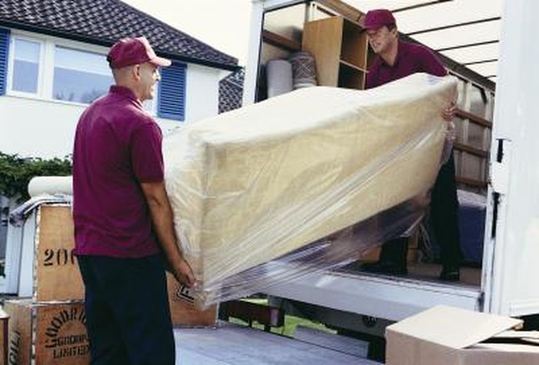 Loading sofa on truck.