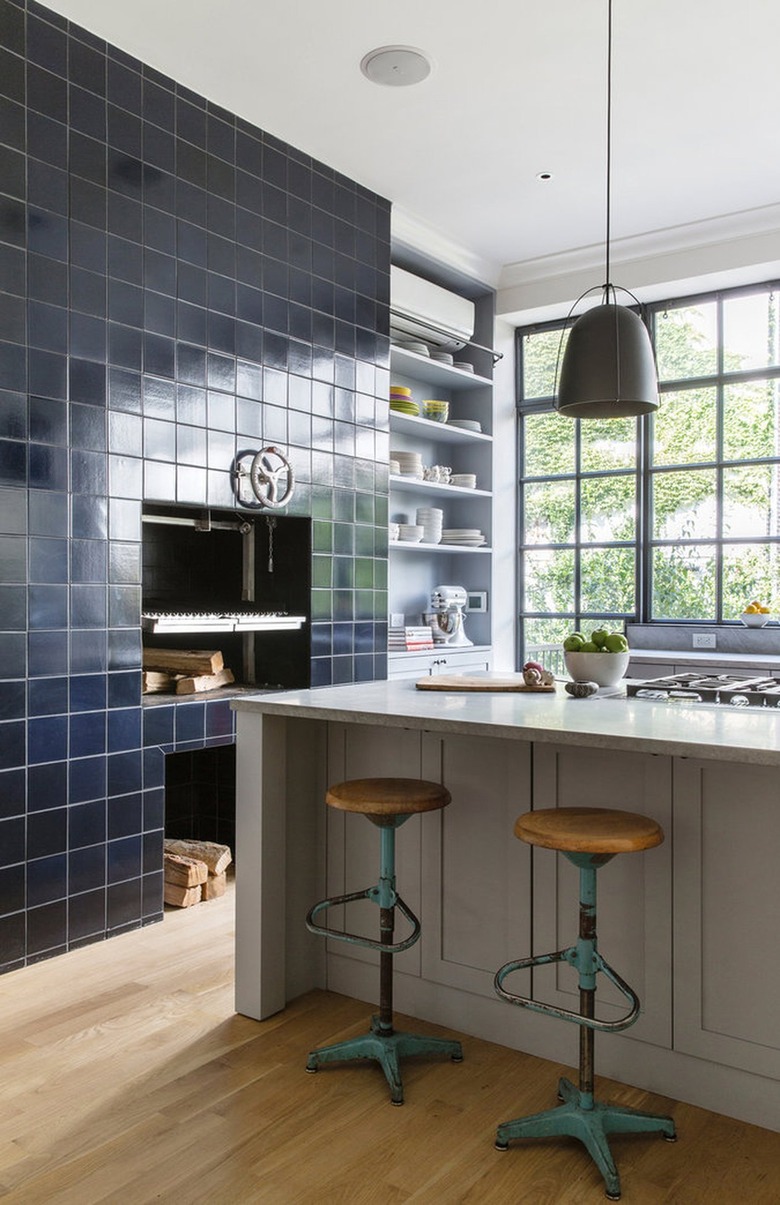 kitchen accent wall with tile framing wood burning stove