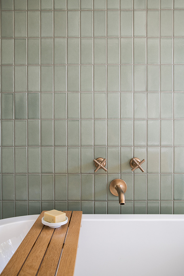 light green ceramic tile on the bathroom wall