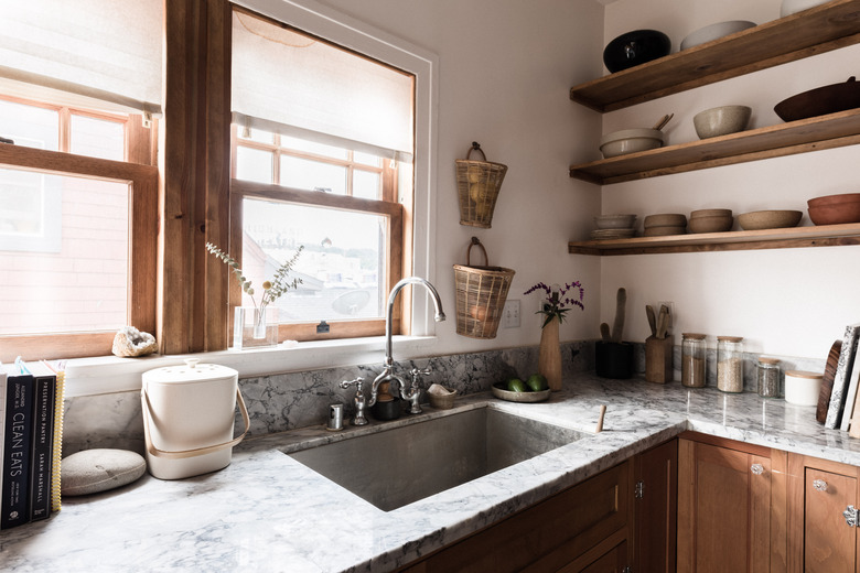 kitchen sink, marble countertop, windows, shelving