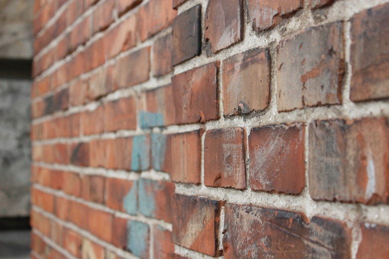 Blue stain on brick wall.