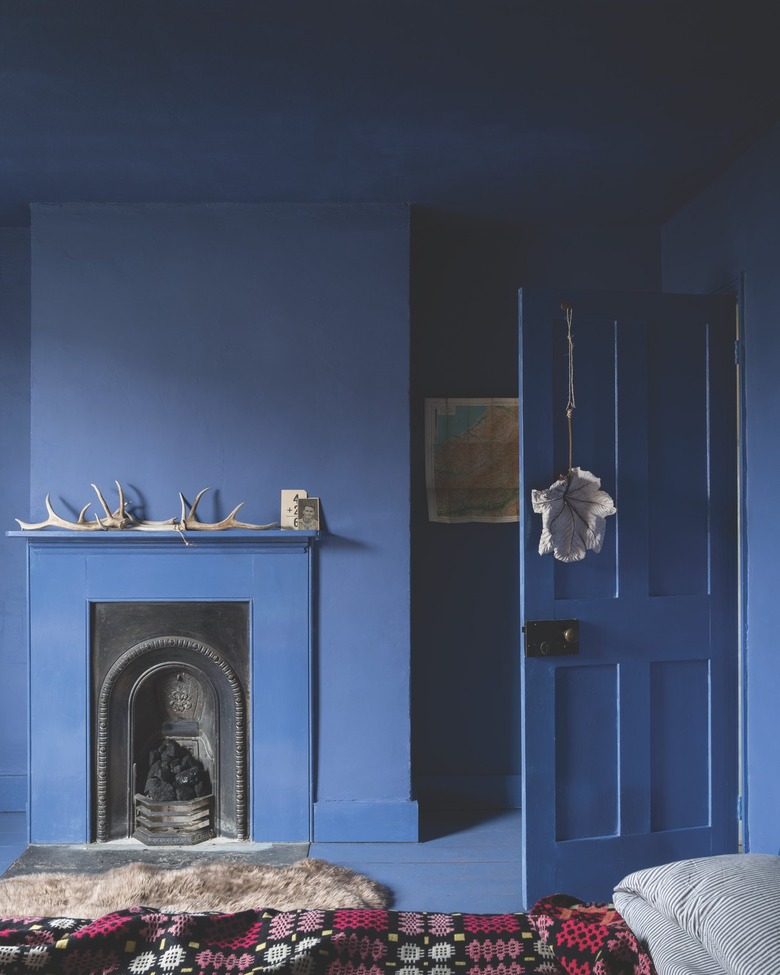 open door and fireplace area painted all in blue