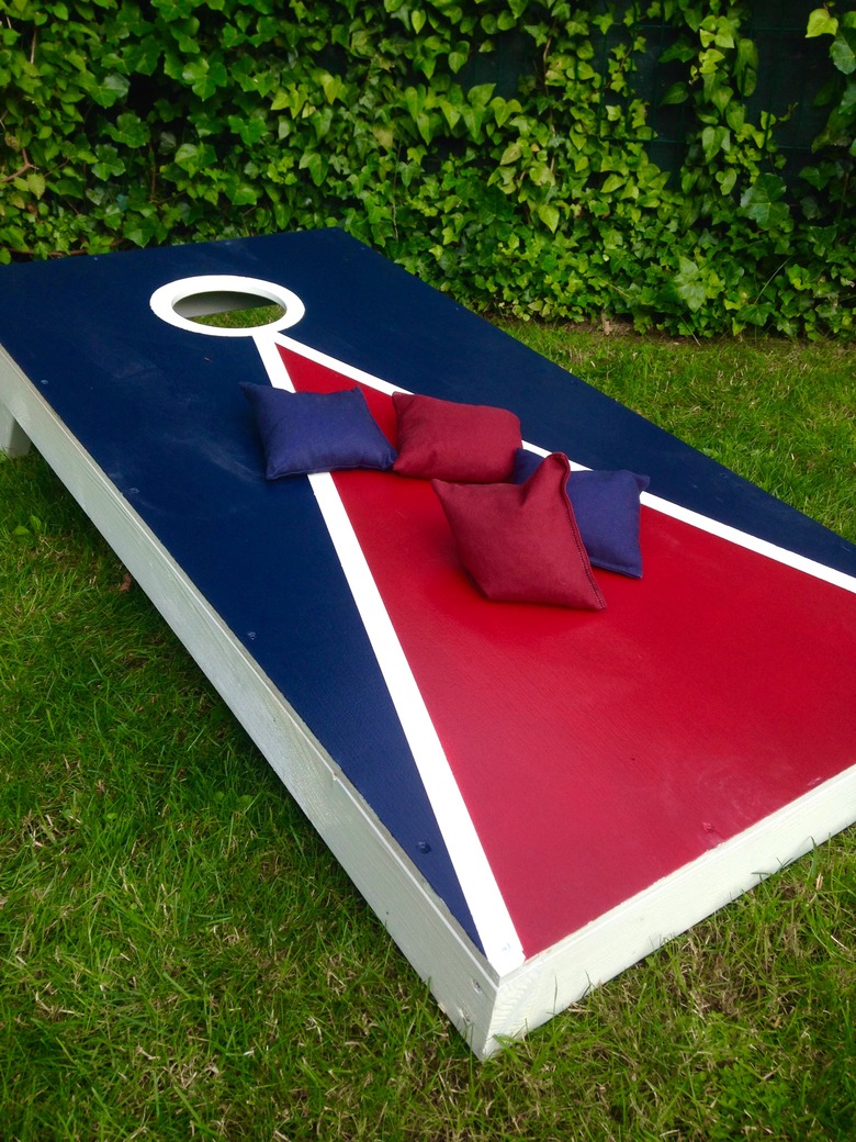 Cornhole Toss Game Board on Grass in Summer