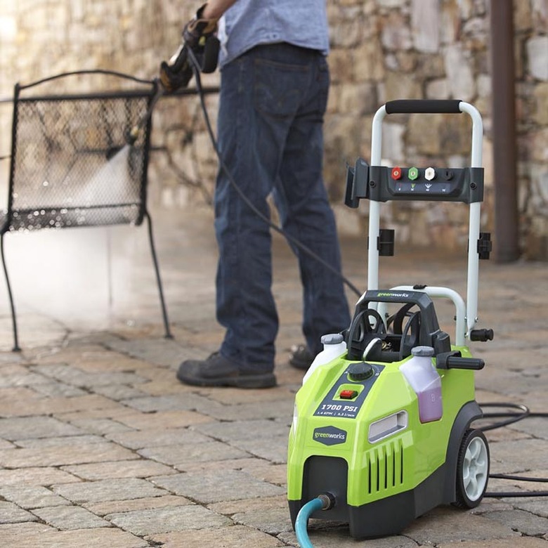 Pressure washing outdoor furniture.