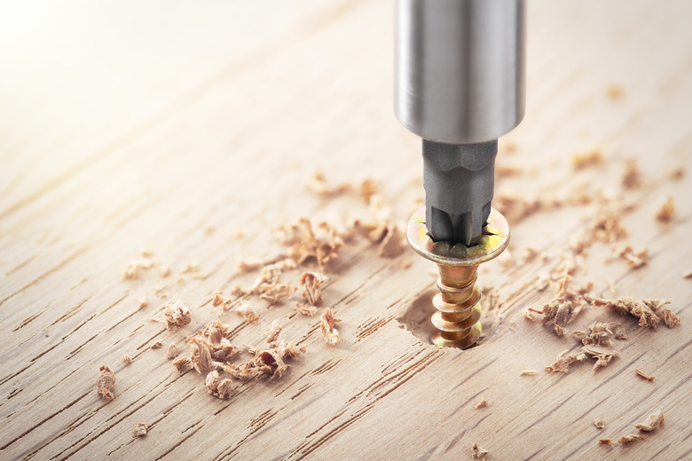 Screwdriver Screw On An Oak Plank