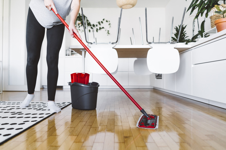 Cleaning wood floor at home.