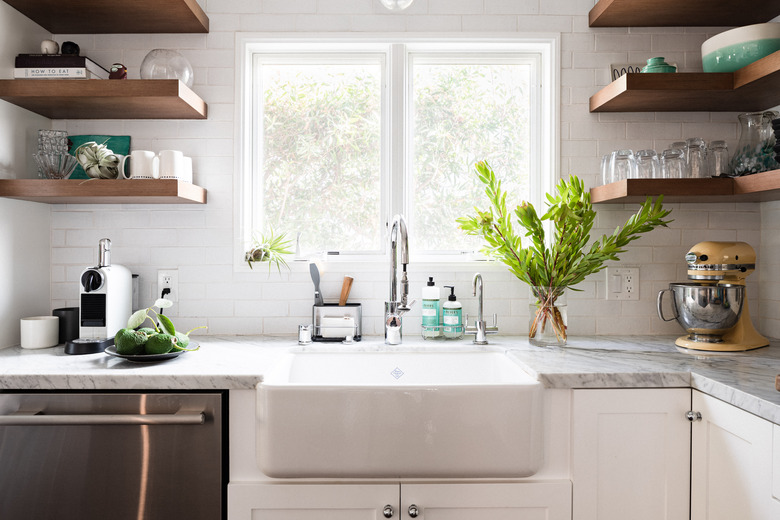 bright white kitchen with farmhouse sink, gray counter