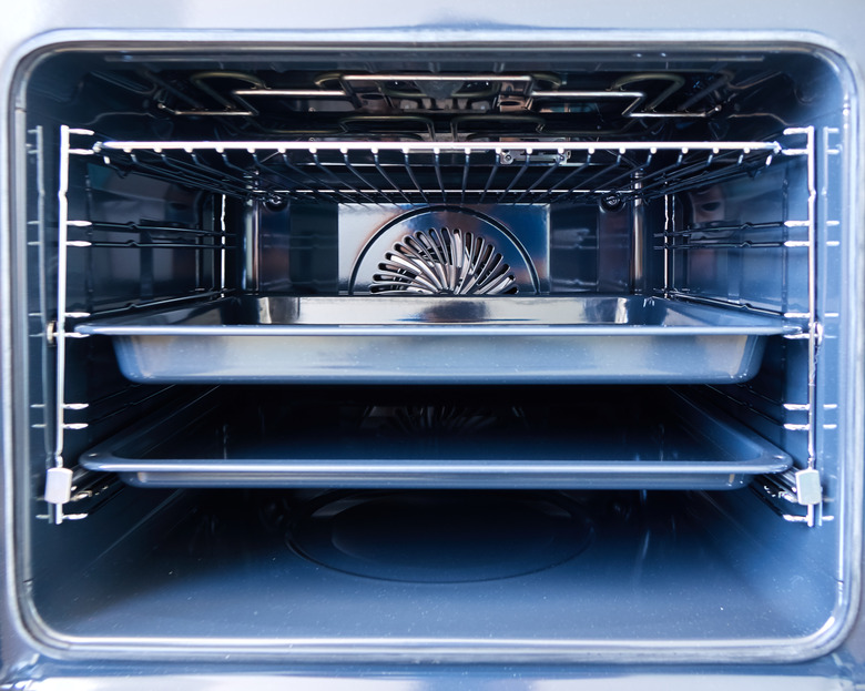 Modern oven with tray inside