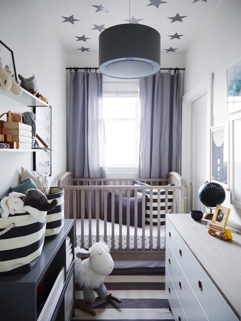 gray, white, and blue nursery idea with striped rug and stars on ceiling