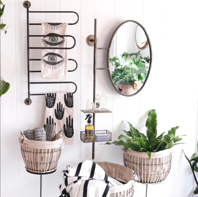 Modern bathroom with towel rack for small bathroom, mirror, and plant