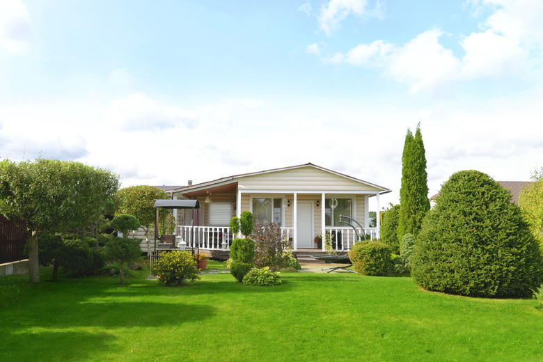 Beautiful house and lawn in country.