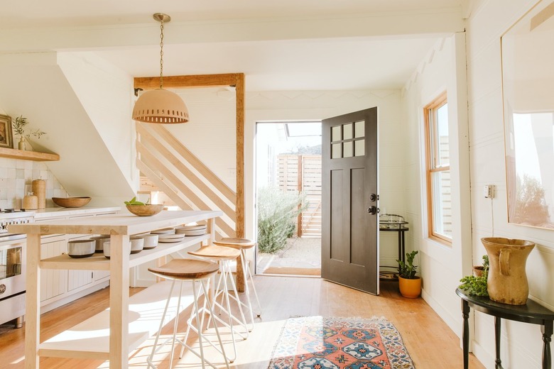 pendant lamp and wooden bar stools with wooden kitchen island in kitchen