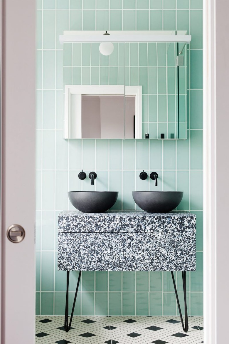 mint green backsplash with black elements