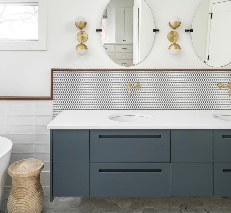 modern bathroom with trio of tile shapes and blue-gray cabinet