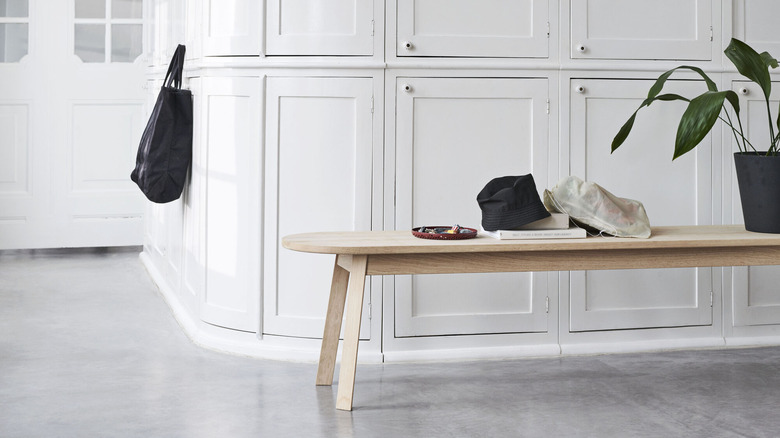 modern bench with plant, book, and other objects