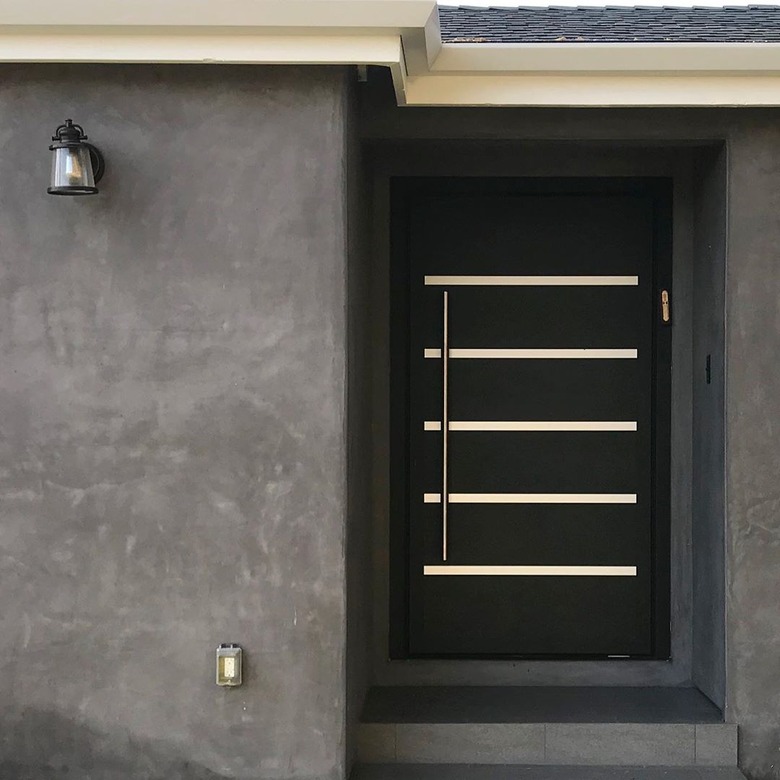 modern exterior door with black and long stainless door handle